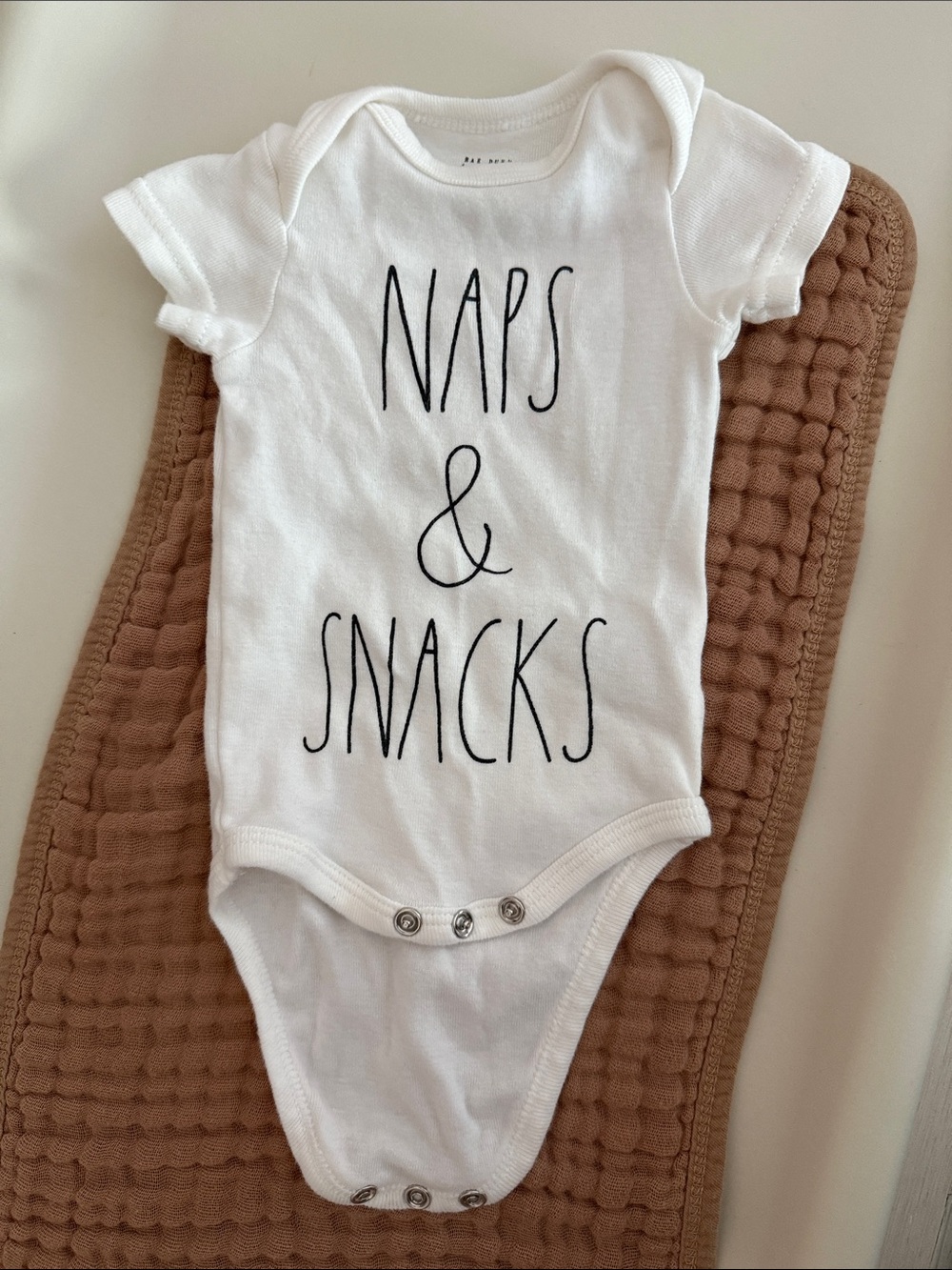 Rae Dunn Baby Naps & Snacks Onesie